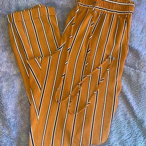 LoveCulture Medium sized orange trousers with black and white vertical stripes